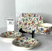 Front view of all four Old Cottage Chintz pieces