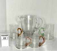 Full lot showing pitcher and four steins