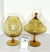 Both Empoli amber glass pieces side by side with scale