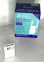 Front view of boxed TP-Link RE315 mesh Wi-Fi extender