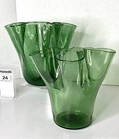 Both green handkerchief vases side by side showing height and rim design