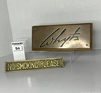 Both brass signs shown together front view