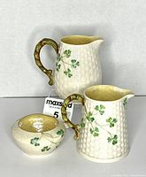 Front view of all three Belleek pieces showing shamrock pattern and basketweave texture
