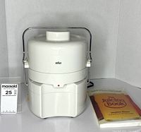 Front view of Braun juicer with book