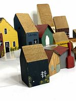 Front view of several painted wooden buildings