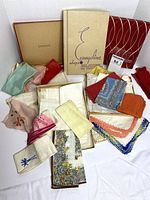Overview of handkerchief assortment with three vintage boxes