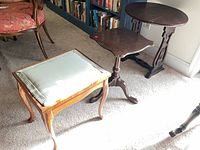 Full view of all three items: pedestal table, drop-leaf table, stool