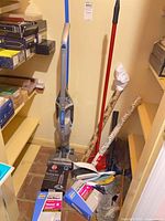 Overall lot with vacuum, bags, dustpan, mop, wrapping paper