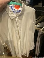 Ivory blouse front view on hanger