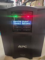 Front view showing APC logo and LCD warning