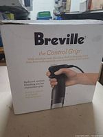 Retail box showing Breville The Control Grip immersion blender and accessories