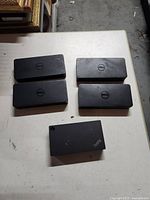 Top view showing four Dell docking stations and one Lenovo ThinkPad unit