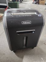 Front view of Fellowes 79Ci shredder showing bin window and casters
