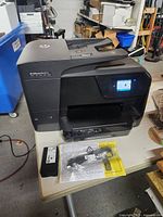 Front and top view of HP OfficeJet Pro 8710 printer on table