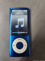 Front view showing blue iPod Nano 5th Gen screen and click wheel