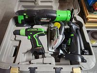 Entire set in case showing drill, reciprocating saw, circular saw, other tool bodies