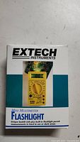 Retail box front showing Extech Instruments mini multimeter flashlight