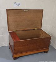 Open blanket chest showing cedar interior and exterior finish