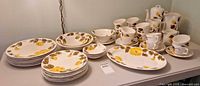 Full view of all dinnerware pieces displayed on table