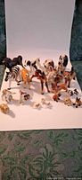 Group shot of all porcelain animal figurines on white background