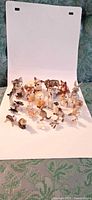 Group shot of entire collection of small porcelain animal figurines