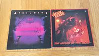 Both signed April Wine LPs side by side