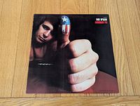 Front album cover featuring thumbs-up artwork