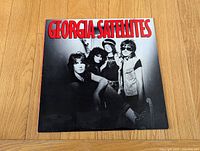 front album cover showing title and band photo