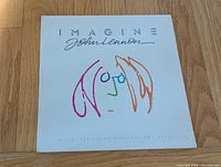 Front of album jacket showing title, signature, and artwork