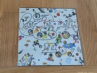 Front cover showing Led Zeppelin III die-cut collage design