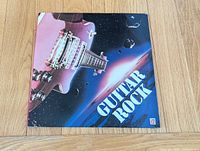 Front cover featuring Guitar Rock artwork