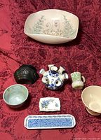 All seven pottery pieces arranged together