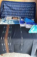 Overview of all textiles draped and laid out