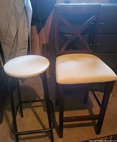 Both stools side by side showing design, materials and wear