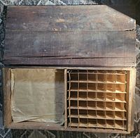 Open crate showing interior egg dividers and missing section