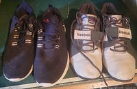 Front view of both pairs showing uppers and lacing