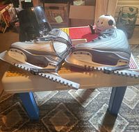 Overall lot showing skates on activity table with bucket and Snoopy figure