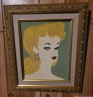 Front view of framed Ponytail Barbie portrait painting