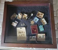 Top view of closed glass-top showcase showing jewellery assortment inside
