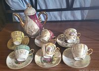Front view of complete porcelain tea service displayed on table