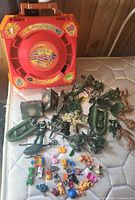 Overview showing Beyblade arena, army toys and miniature figures