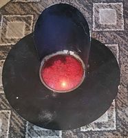 Front view showing red lens and black metal shroud