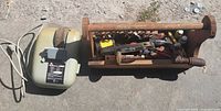Overall lot showing wet sharpener with power cord and toolbox of vintage tools