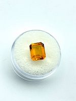 Top view of emerald-cut citrine showing color and facets
