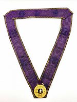 Full view of purple ribbon with medal attached