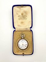 Watch in open velvet case showing dial and lining