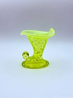 Side view showing full cornucopia vase profile and color