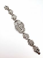 Full view of antique silver diamond bracelet laid flat