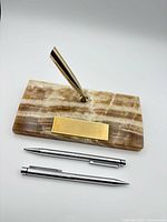 Pen stand, pen, pencil laid out