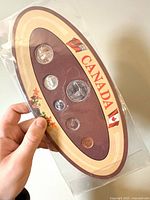Front of sealed 1967 Canadian coin set showing six coins in cardboard holder